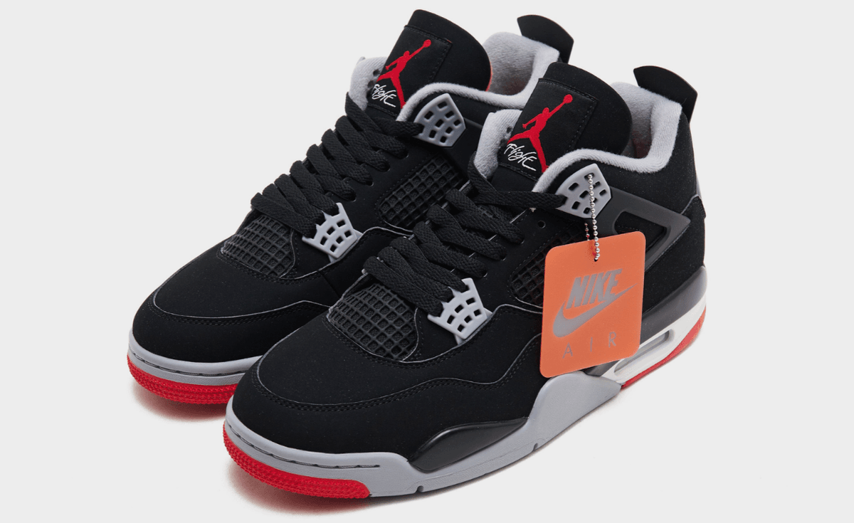 Air Jordan 4 Retro Bred OG featuring black nubuck upper with grey lace wings and Chicago red accents