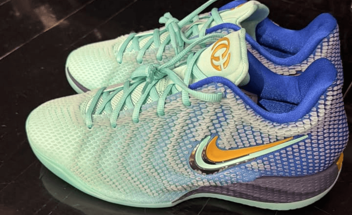 Nike Caitlin 1 in mint green and racer blue colorway, featuring gradient upper and chrome/mint/gold Swoosh detailing