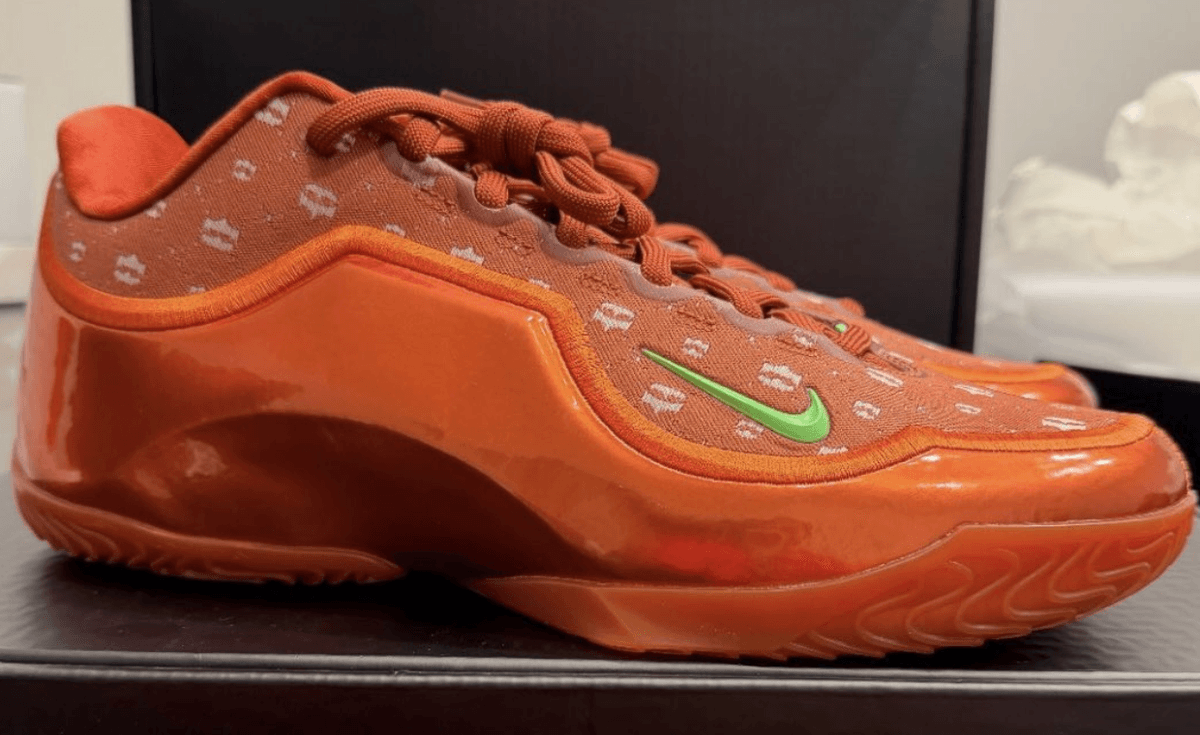 Nike LeBron 23 EYBL PE in orange with white crown graphics and green Swoosh detail