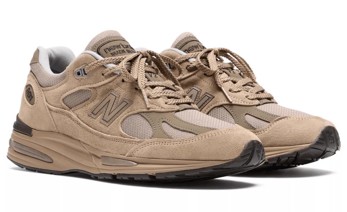 New Balance 991v2 Made in UK in walnut brown with sandy suede overlays, side profile view