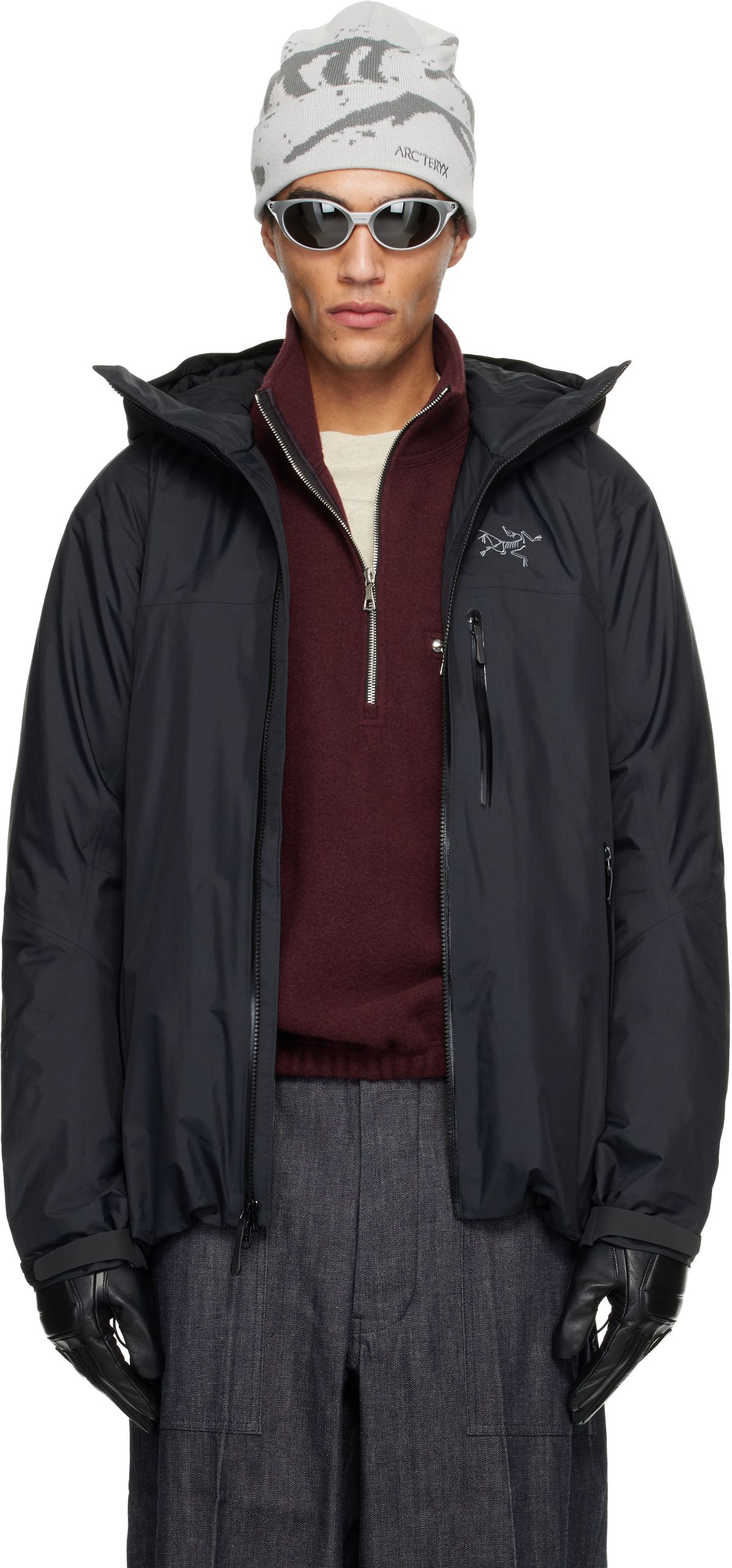 Arc'teryx Black Beta Insulated Jacket, three-quarter front view showing articulated patterning and integrated hood