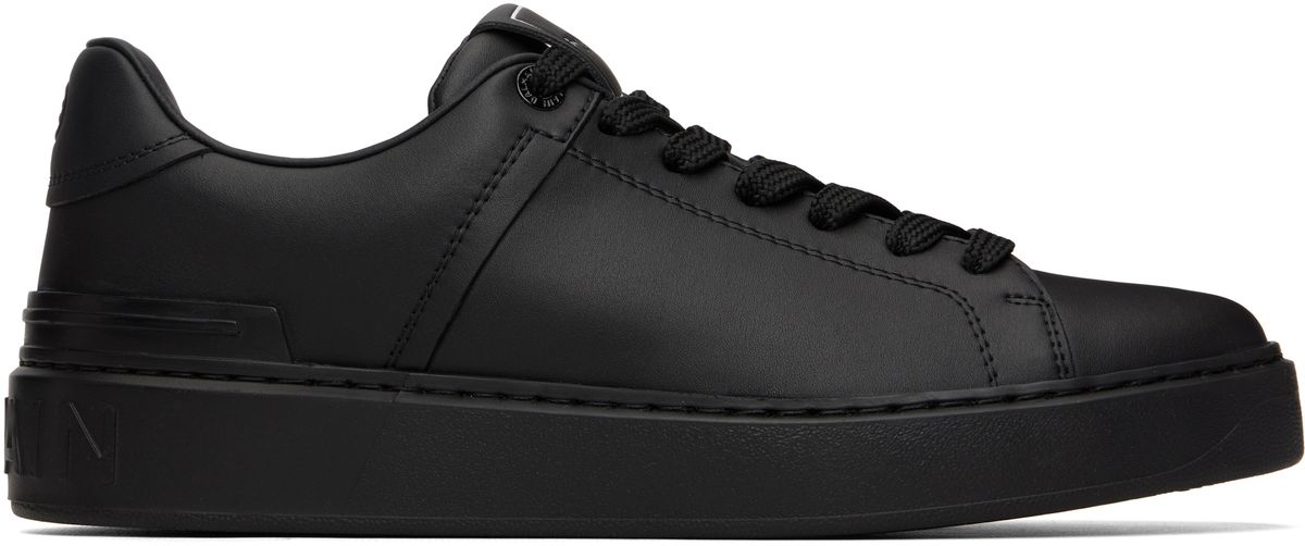 Balmain B-Court in black leather, side profile view showcasing minimalist court silhouette and tonal branding