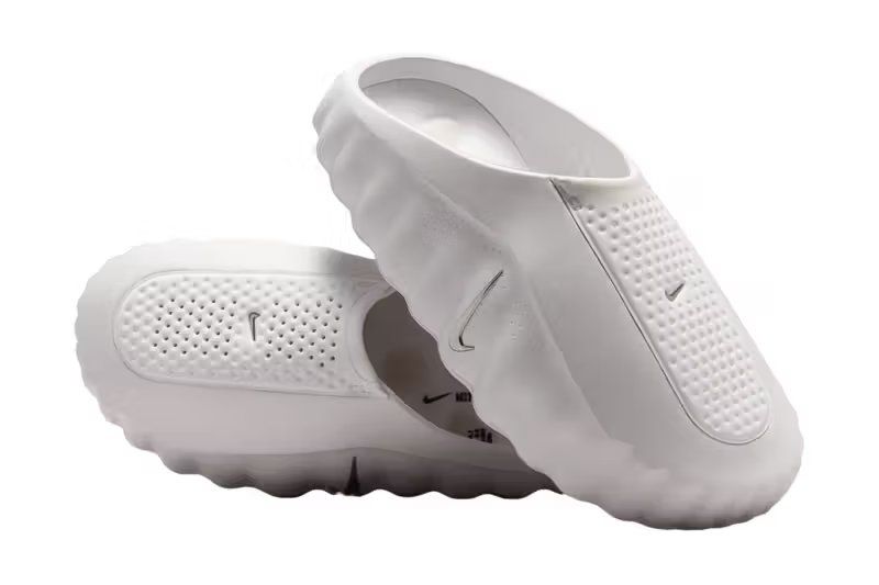 Nike Mind 001 in White and Metallic Silver colorway, featuring molded foam upper and 22-pod underfoot platform