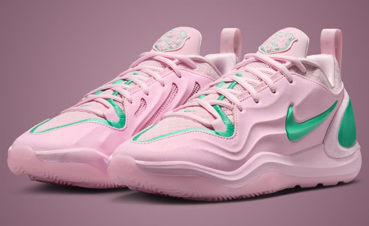 Nike A'Two Pinkies Up in pink and green Alpha Kappa Alpha colors, shown from side angle with embroidered toebox border and green Swoosh detail