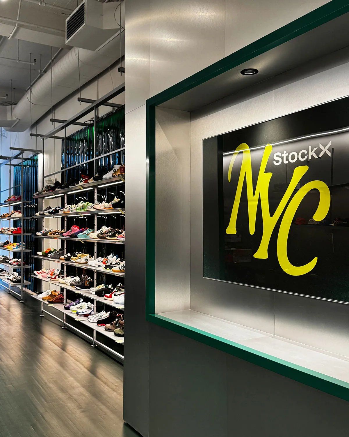 Interior view of StockX's renovated NYC flagship store in SoHo, displaying sneaker inventory and retail display fixtures