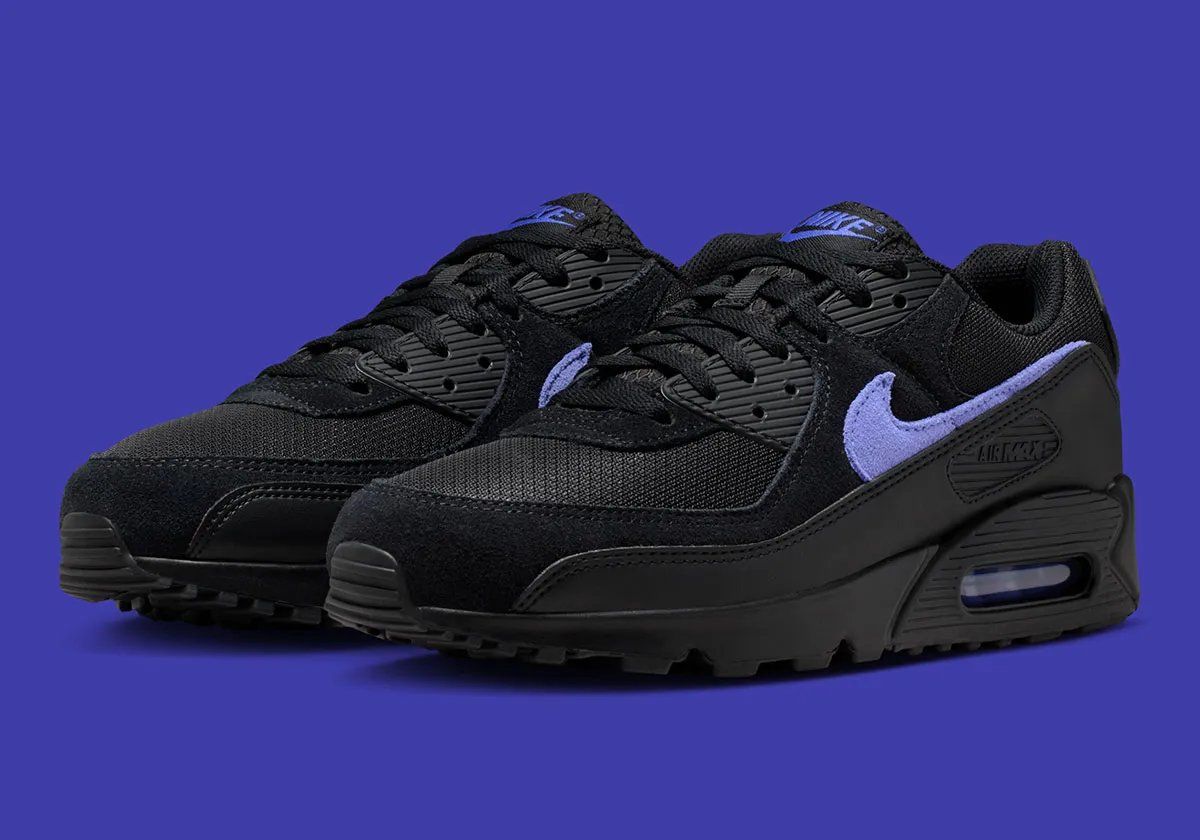 Nike Air Max 90 in Black/Sapphire colorway, showing visible Air Unit and side profile