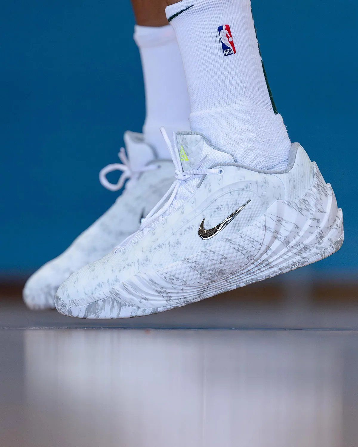 Nike Giannis Freak 8 Wolf Grey with camo-print upper, chrome Swoosh, and Volt tongue branding