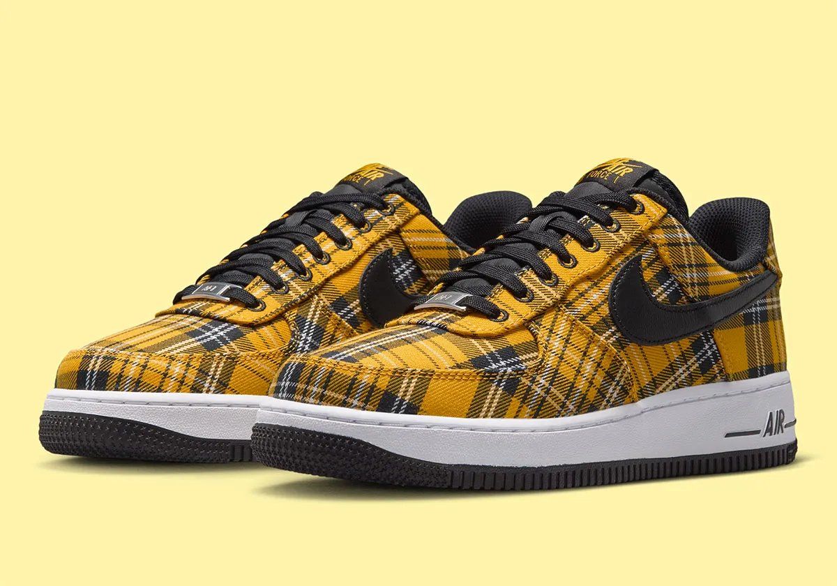 Nike Air Force 1 Low in yellow plaid with white upper and black trim, front three-quarter view