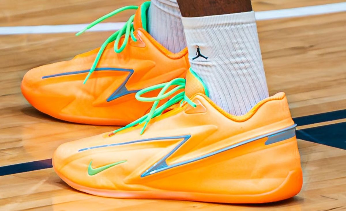 Nike KD 19 EYBL Peach Jam PE in bright orange with green peach stem accents and steel blue stabilization panels