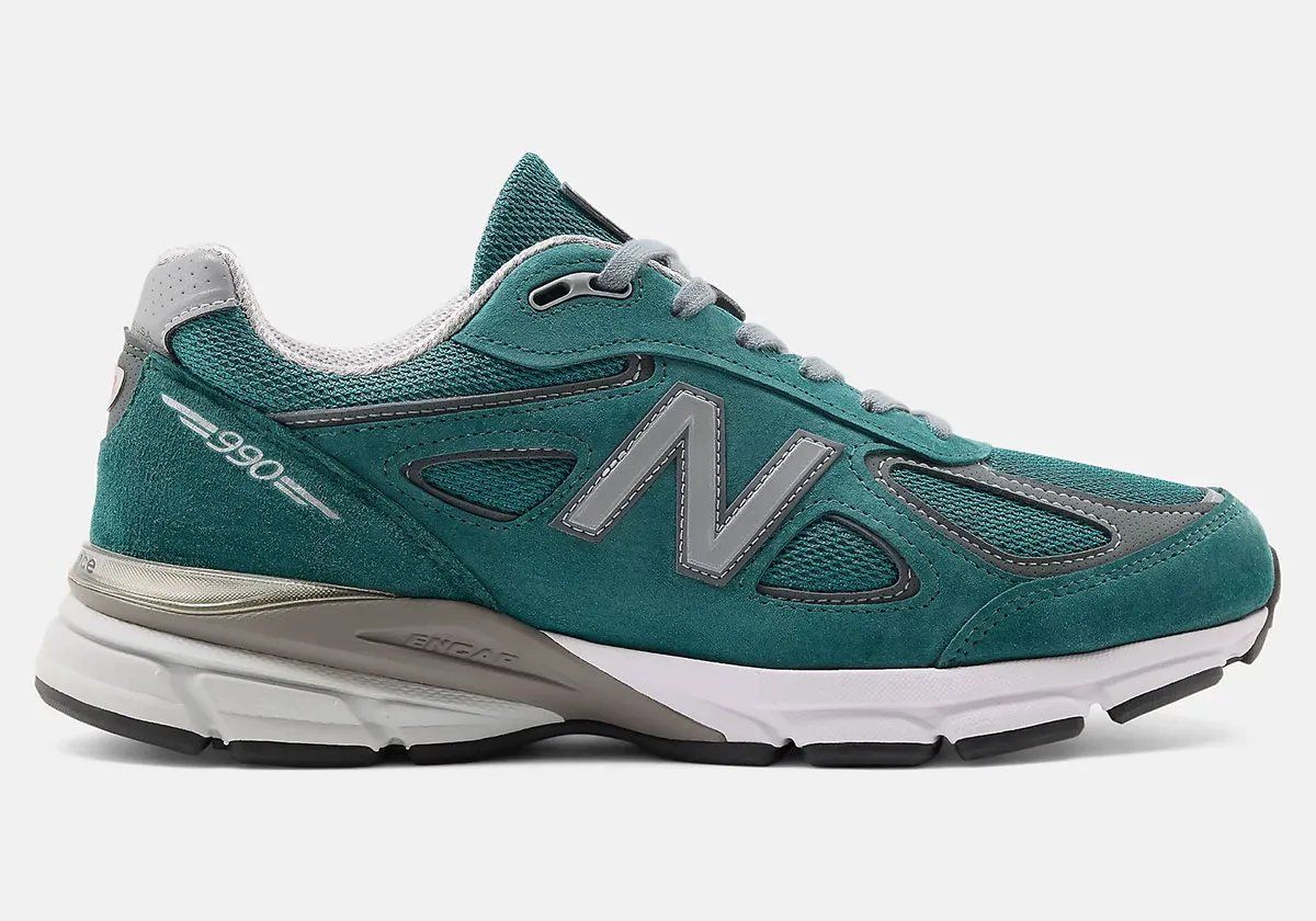 New Balance 990v4 in teal with grey accents, side profile view