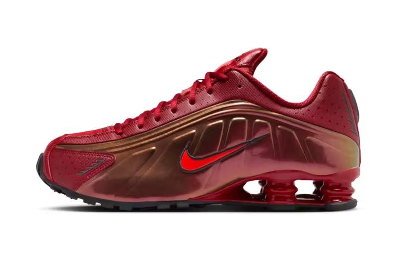 Nike Shox R4 in Team Crimson and Black colorway, side view showing column spring technology and Iron Man-inspired aesthetic