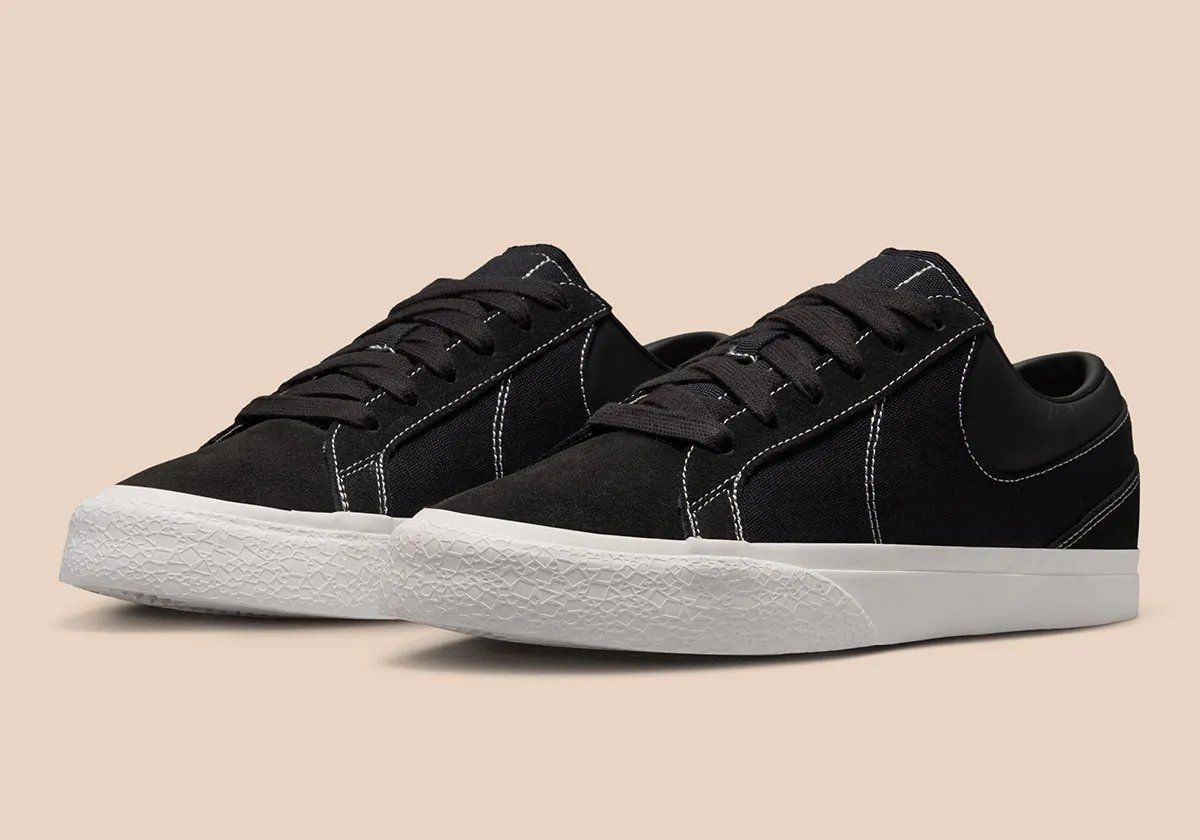 Nike Blazy in Sail colorway, showing exaggerated heel drag and curved Swoosh stitching detail on canvas panels