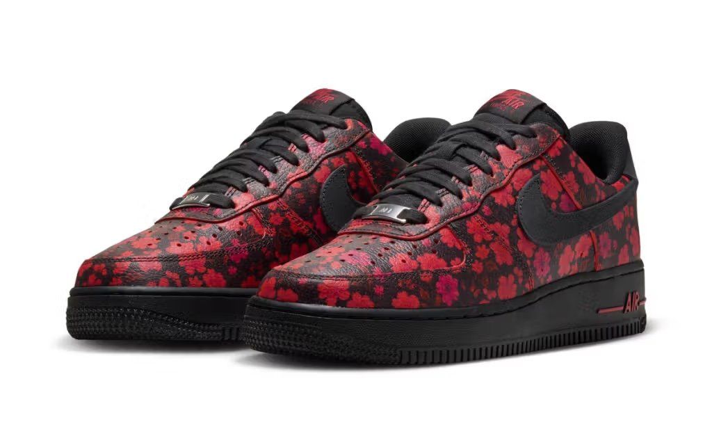 Nike Air Force 1 in black leather with red accents and floral detailing on the upper