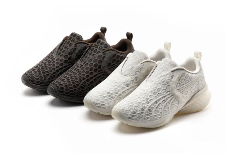 Puma x _J.L-A.L CELL GEO 1 CAGE JL-AL in dark brown and white, featuring geometric 3D TPU cage overlay on breathable mesh upper