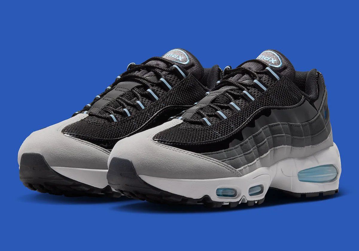 Nike Air Max 95 in Black with grey suede panels and Football Blue Swoosh, showing patent leather side paneling detail