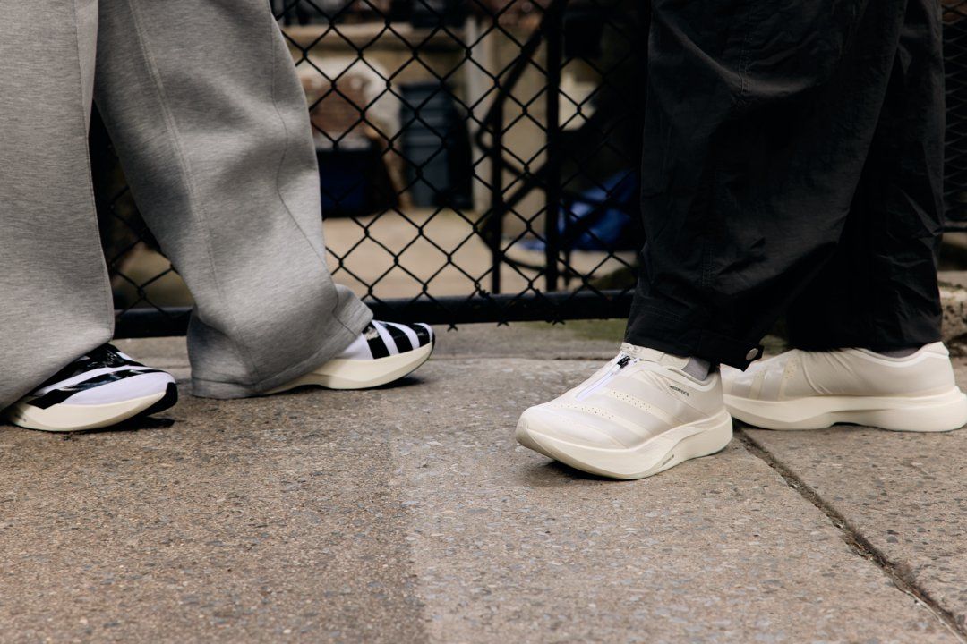 adidas Adizero EVO SL Zip in Cloud White and Core Black with distinctive full-length zippered shroud and Lightstrike Pro cushioning