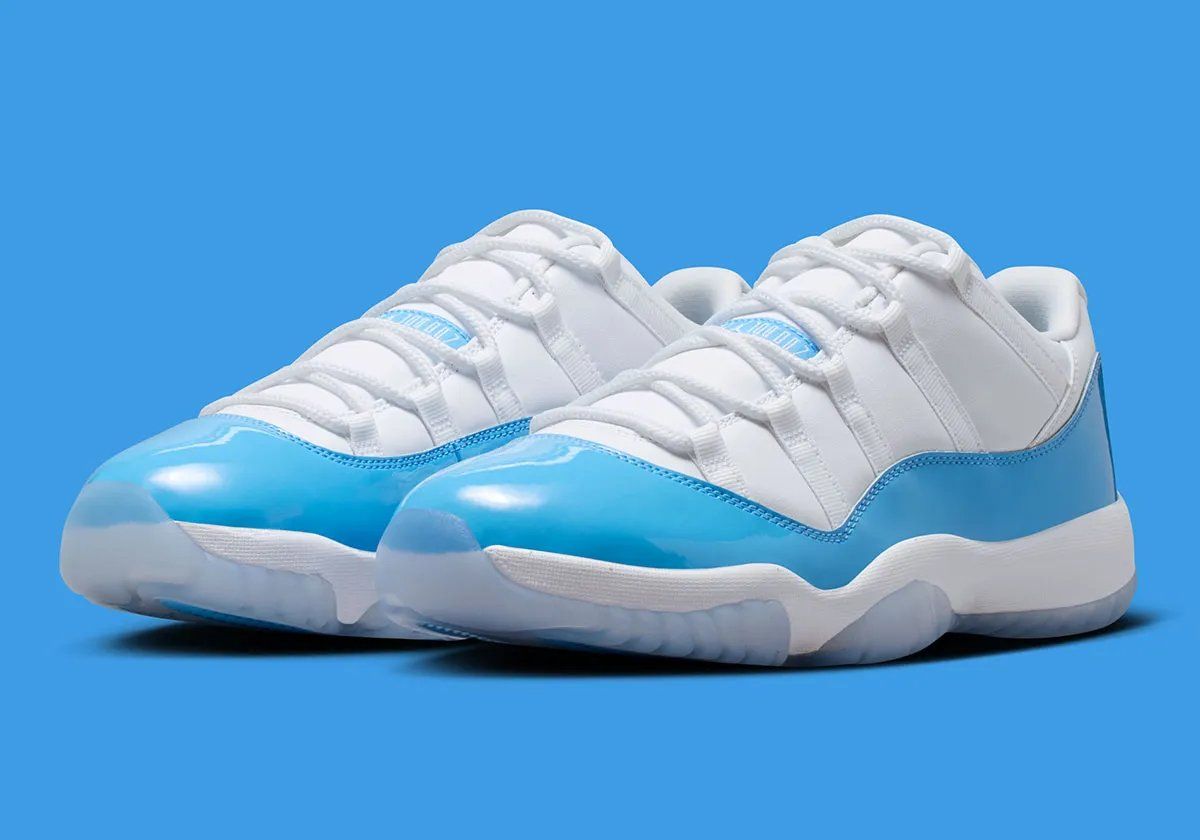 Air Jordan 11 Low in University Blue and white, showing mudguard detail and icy translucent sole