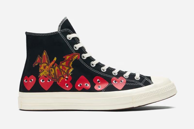 Future and Robert Nava's COMME des GARÇONS PLAY x Converse Chuck Taylor 70s in black and white, featuring painted artwork on canvas.