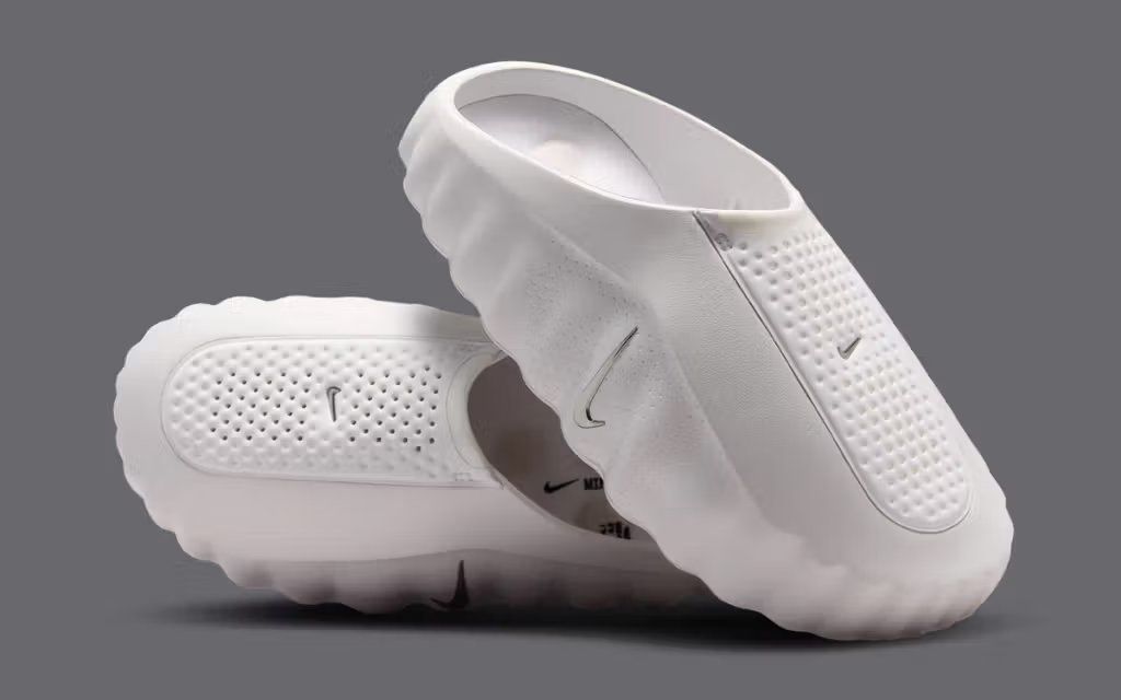 Nike Mind 001 Summit White sneaker displayed from lateral side view, showing clean white leather and minimal branding