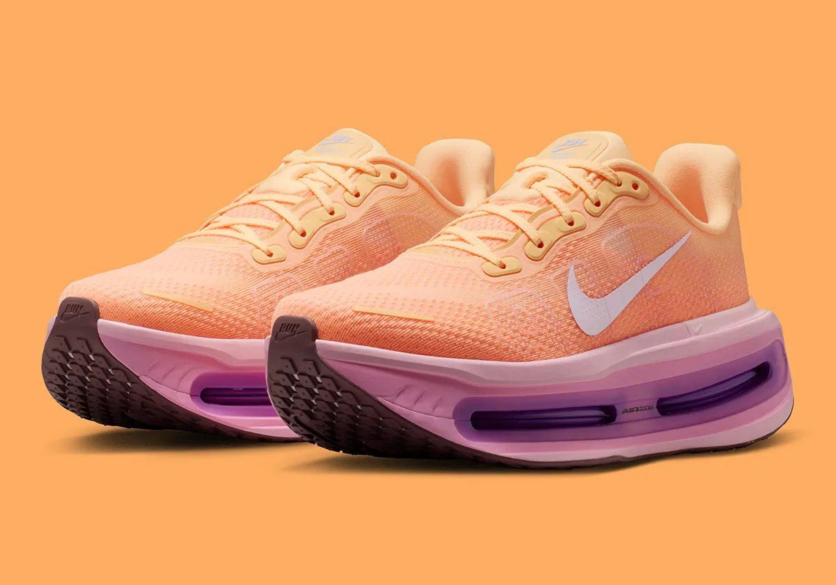 Nike Vomero Premium in Tangerine Tint colorway, showing side profile of the premium lifestyle running shoe