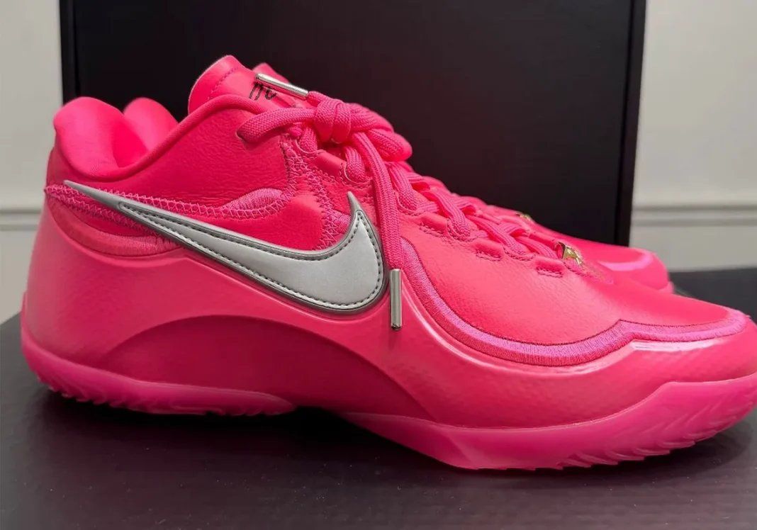 Nike LeBron 23 Hyper Pink, a all-pink basketball shoe with metallic silver Swoosh honoring LeBron James's all-time scoring record