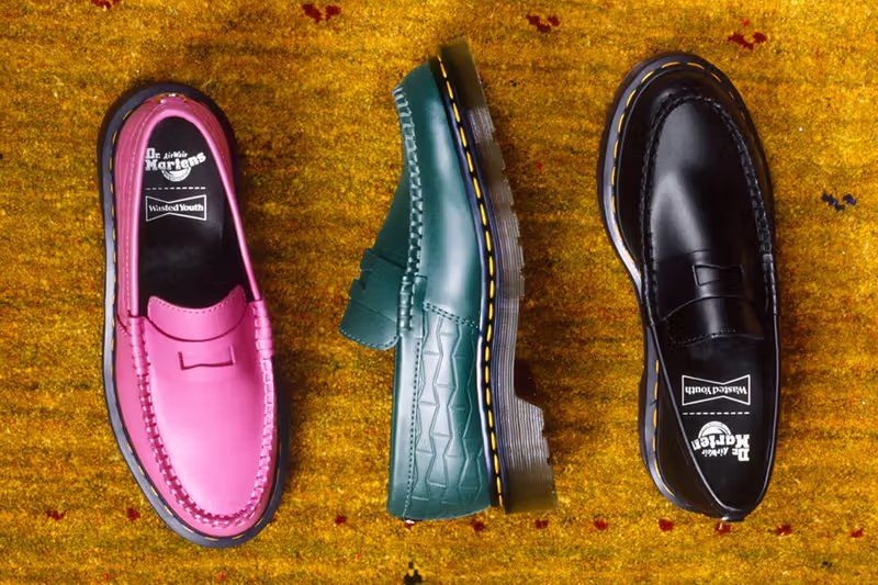 Dr. Martens x Wasted Youth Penton Loafer in black leather with embossed bowtie logo motif and yellow welt stitching