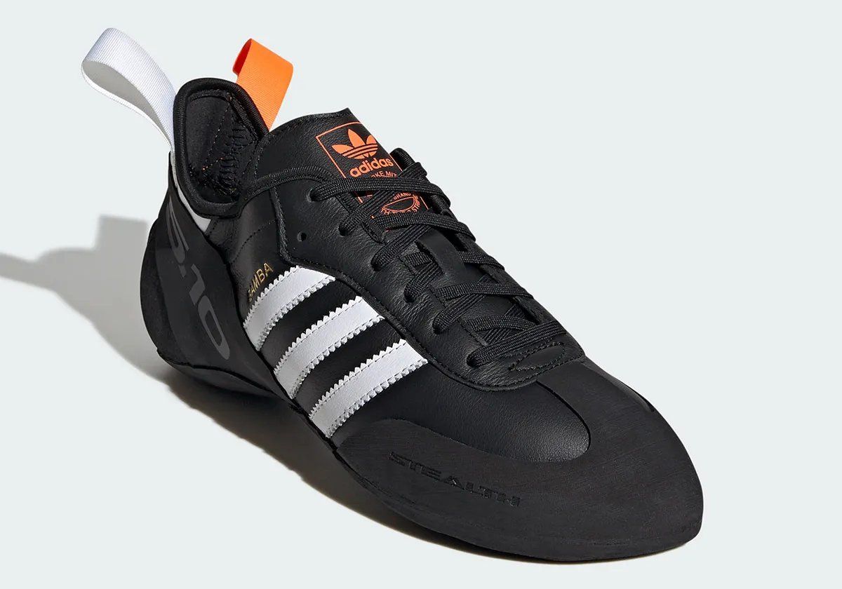 Adidas Samba Climbing Shoe in black, white, and orange colorway with curved Five Ten STEALTH Rubber outsole