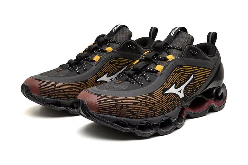 Mizuno Wave Prophecy 13.2 in Tokyo Sunset colorway featuring charcoal, white, and orange uppers with full-length Infinity Wave sole unit