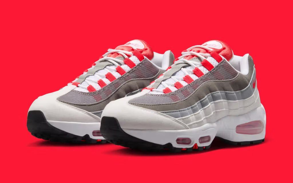 Women's Nike Air Max 95 in White and Light Crimson colorway, showcasing the model's layered construction and visible Air unit