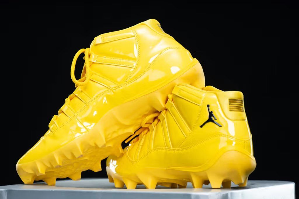 Air Jordan 11 Cleat PE in Varsity Maize colorway designed for Michigan Wolverines football program
