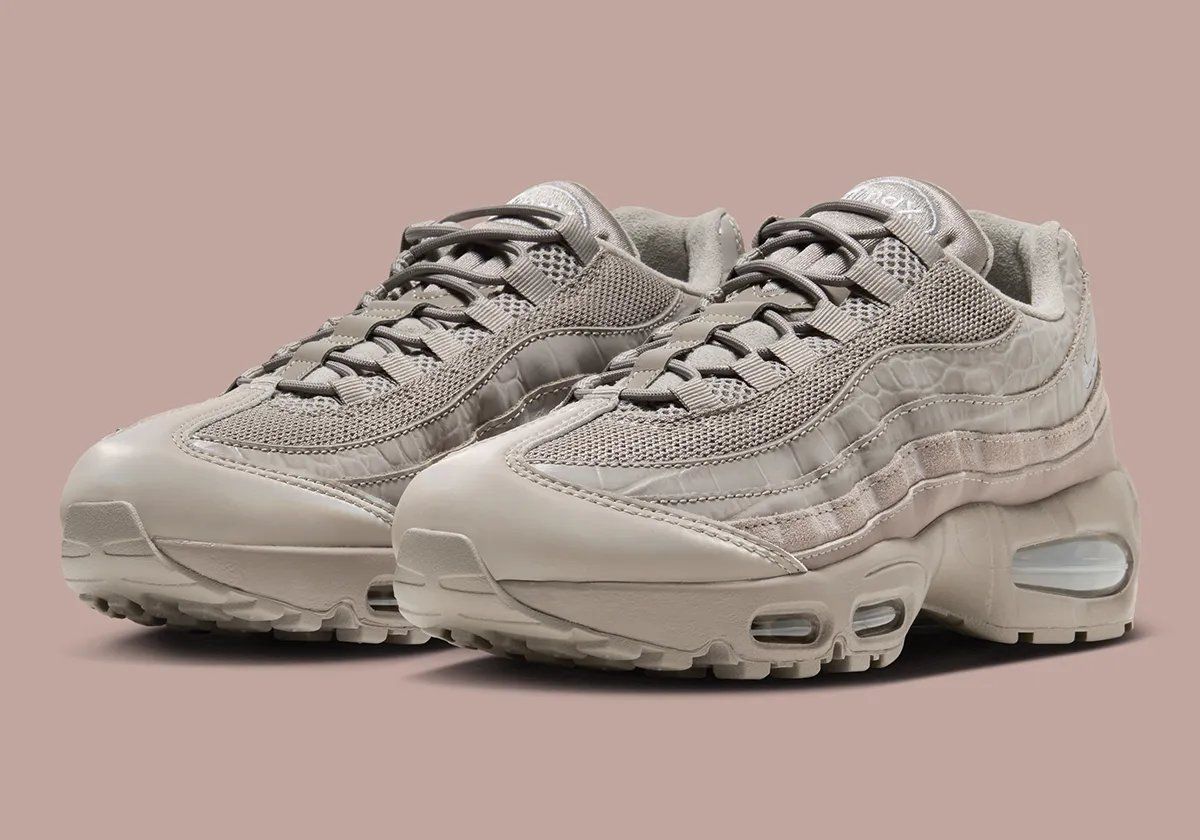 Nike Air Max 95 Enigma Stone women's sneaker featuring debossed croc leather side panels and hairy suede overlays