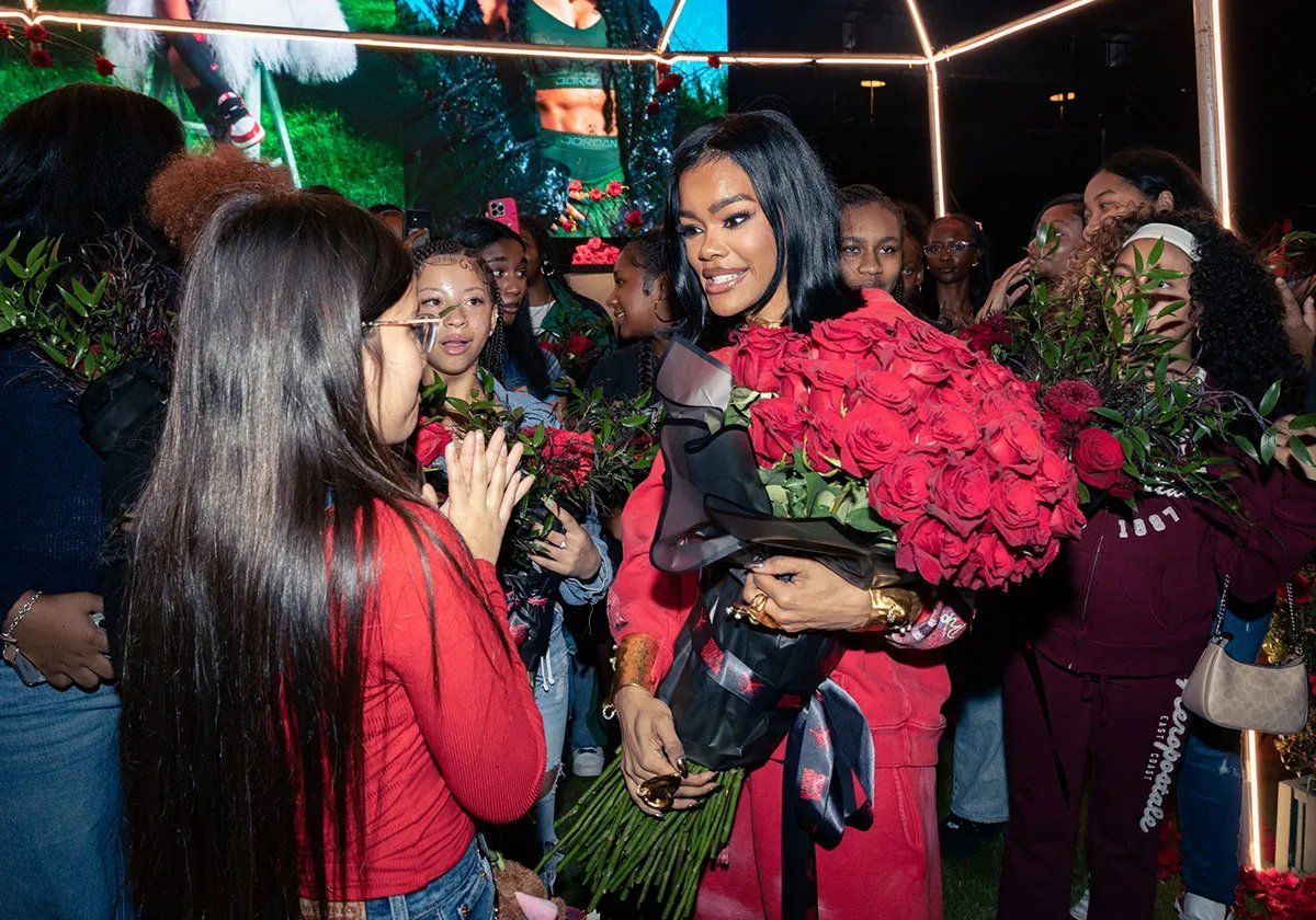 Teyana Taylor wearing Air Jordan 3 Concrete Rose sneakers at NBA All-Star Weekend