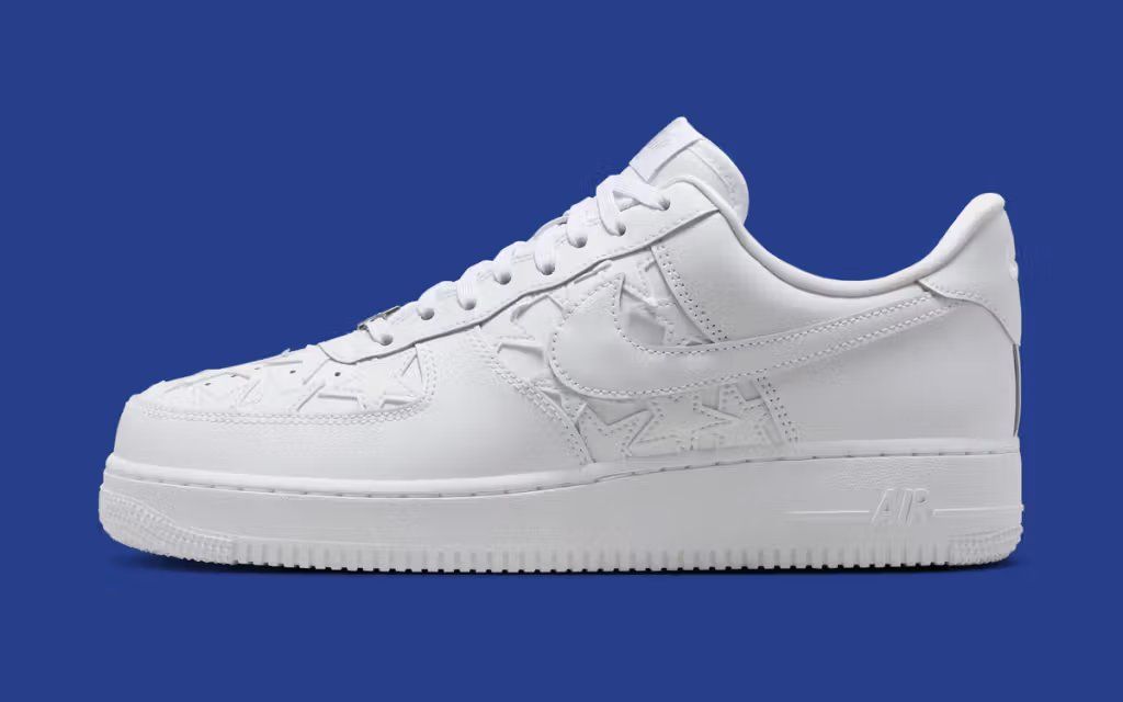 Nike Air Force 1 Low Triple White Stars sneaker with star detailing, full-grain white leather construction