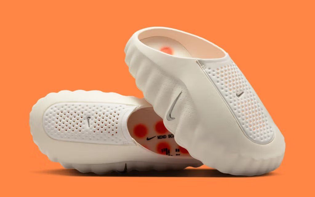 Nike Mind 001 in Sail colorway, lateral and medial views showing the minimalist silhouette and clean off-white upper