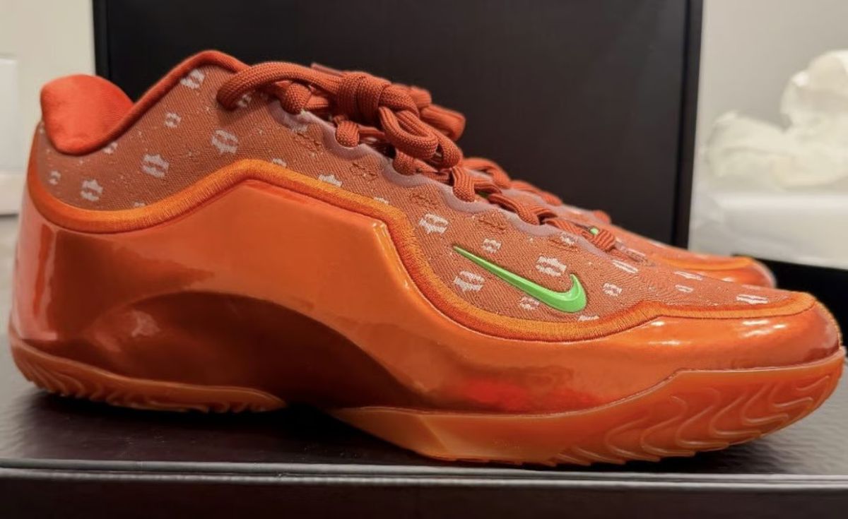 Nike LeBron 23 EYBL PE in orange with white crown graphics and green Swoosh detail