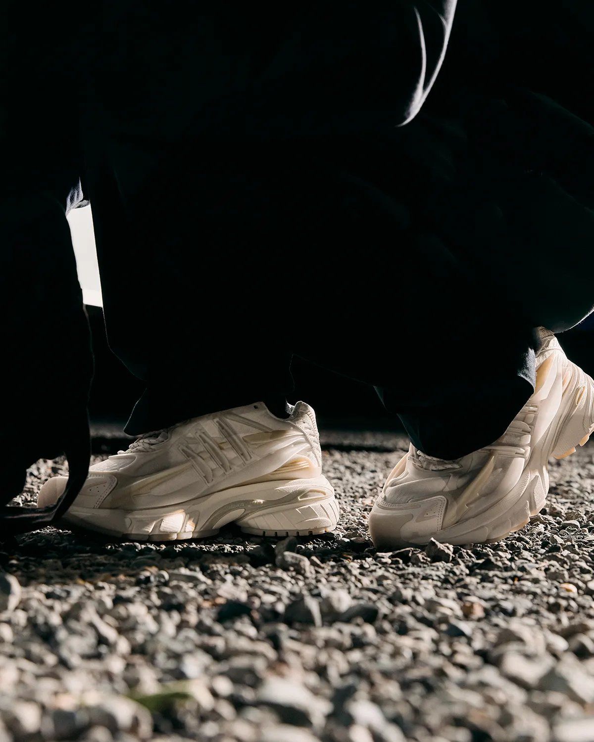 Pharrell x adidas Jellyfish Triple White sneaker in full white colorway, showing layered upper construction and extended toe box from multiple angles