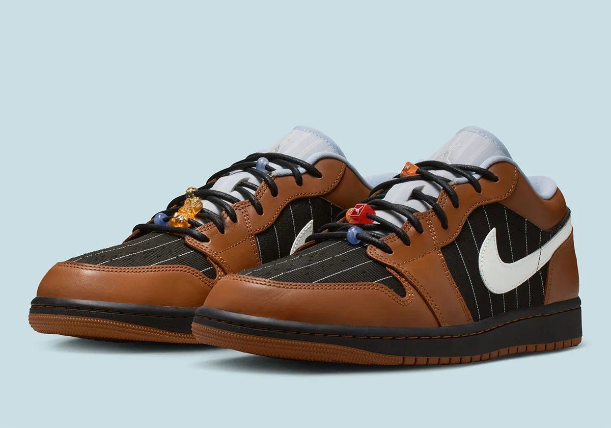 Air Jordan 1 Low in Black and Light British Tan pinstripe textile with brown leather overlays and textured laces