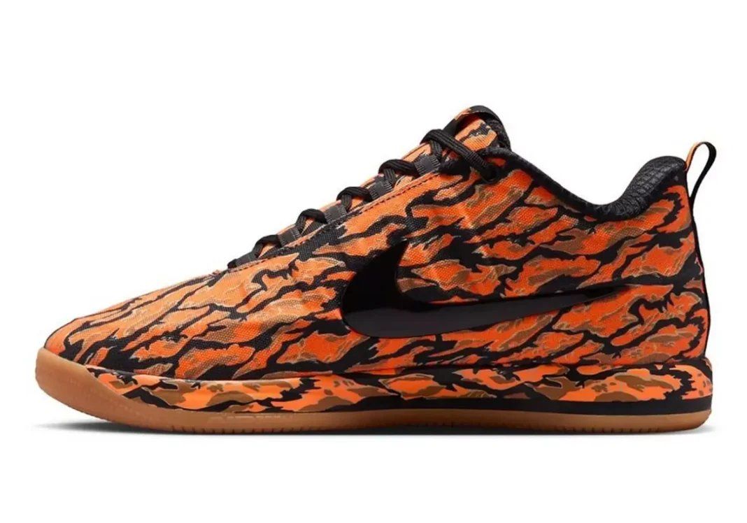 Nike Book 2 Tiger Camo in black, total orange, and flax with full camouflage pattern coverage
