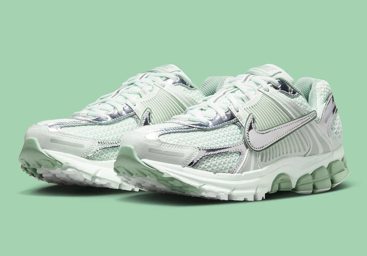 Nike Zoom Vomero 5 in Barely Green with metallic silver chrome accents and dual Swoosh detail