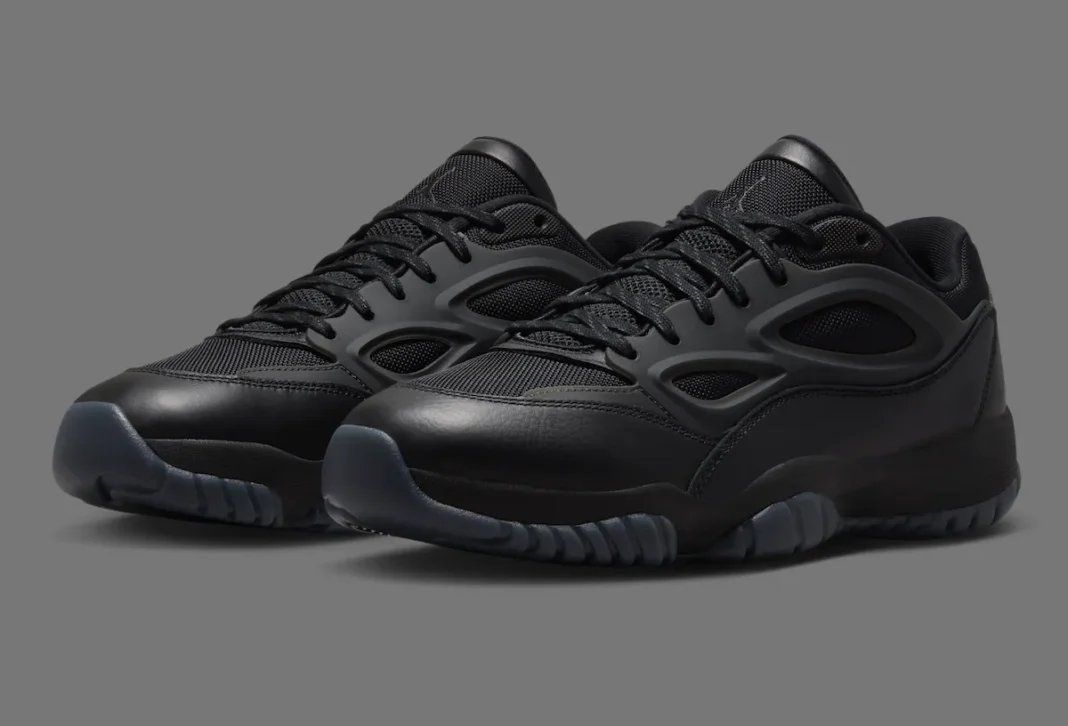 Jordan DMSN 95 in Black/Dark Smoke Grey showing mesh upper and molded TPU cage detail