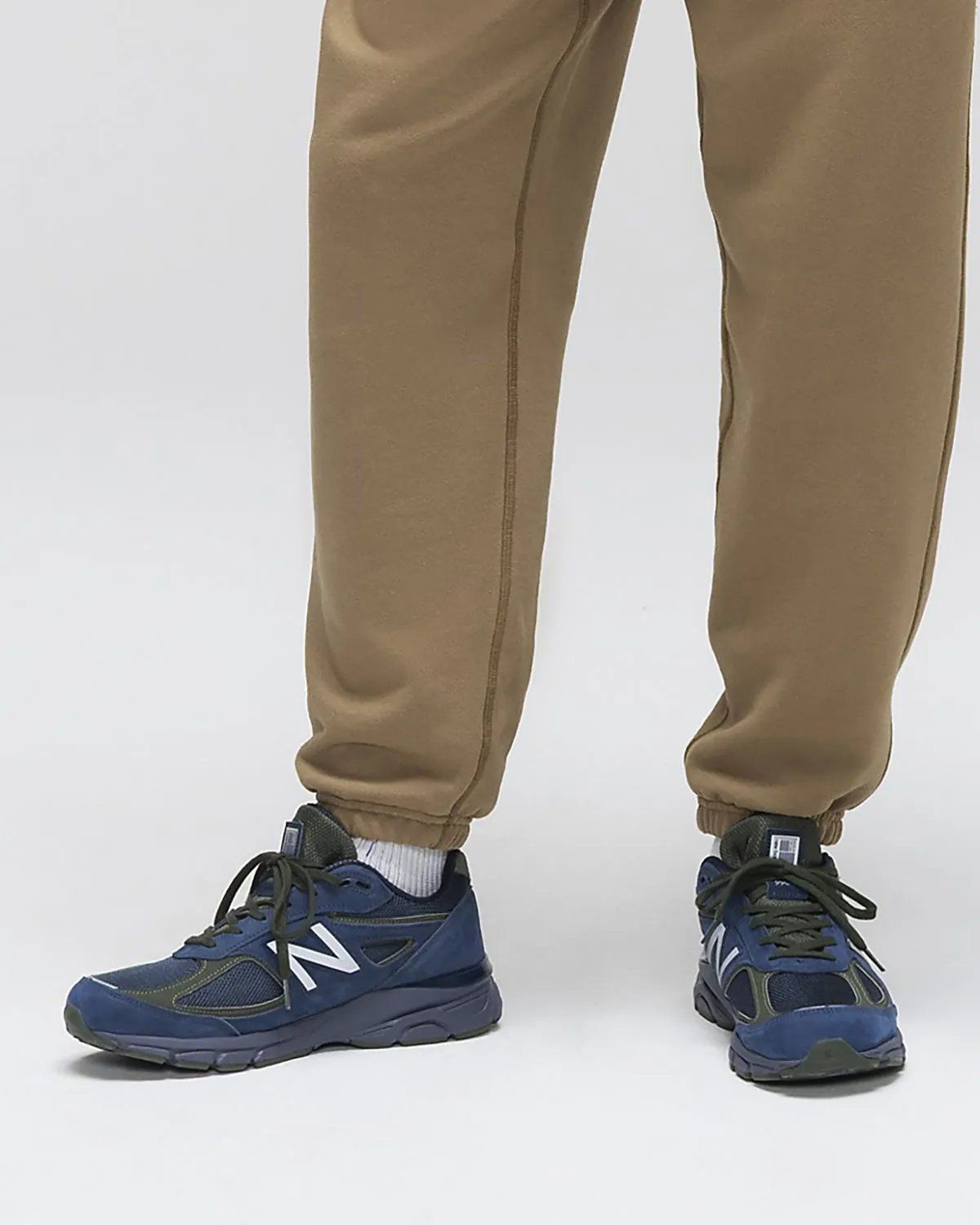 New Balance 990v4 in NB Navy and Meteorite colorway, showcasing leather and nubuck construction for Fall/Winter 2026