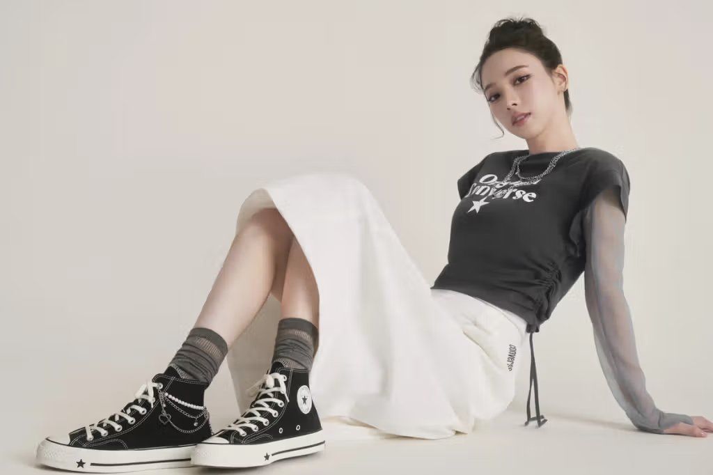 aespa's KARINA wearing Converse Chuck 70 sneakers, showcasing the silhouette's refined canvas upper and rubber toe cap detail