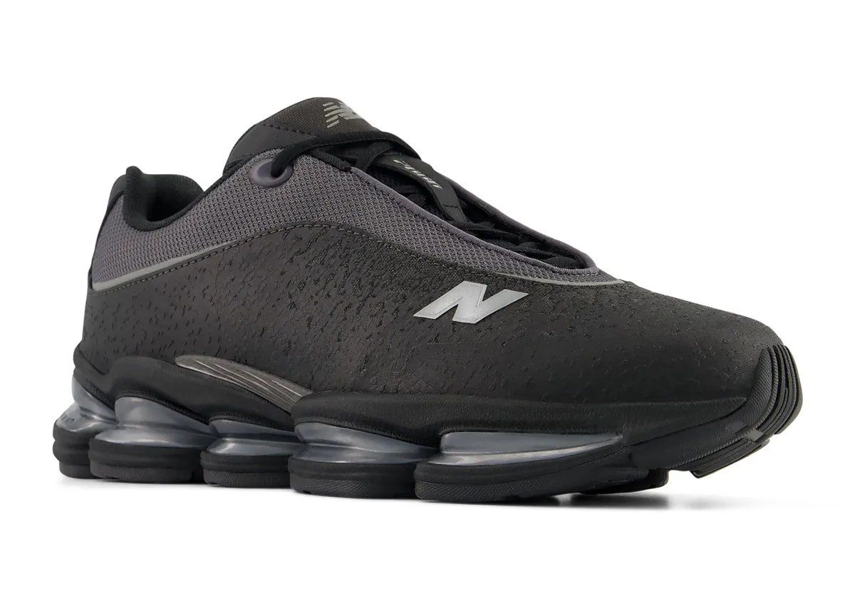 New Balance 2000 Sleek in grey colorway, featuring mesh upper and textured leather lower panel with reflective detailing