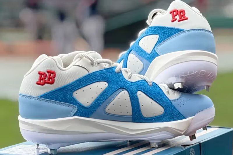 adidas BadBo 1.0 baseball cleat in light blue, deep blue, and cream colorway for Puerto Rico national team
