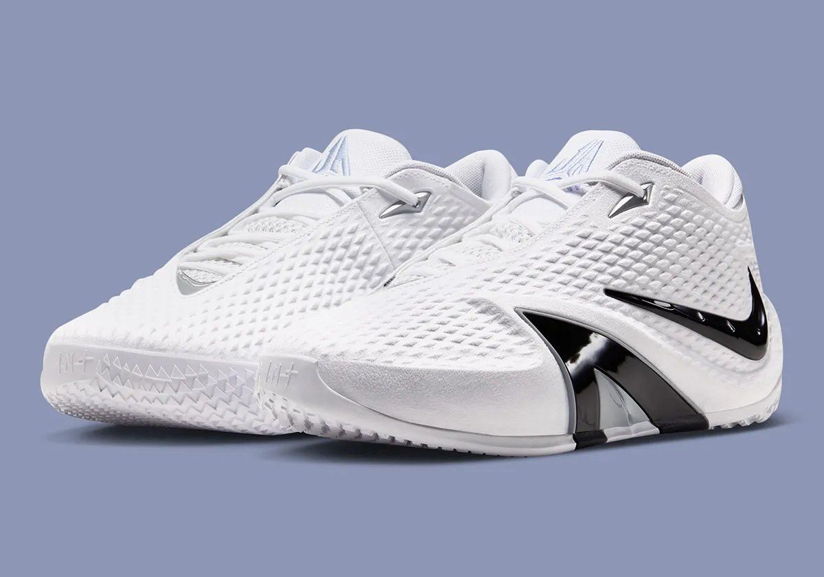 Nike Ja 4 in White with Cobalt Bliss, Photon Dust, and Black colorway, showing the white upper, black Swoosh, and A-Frame detail