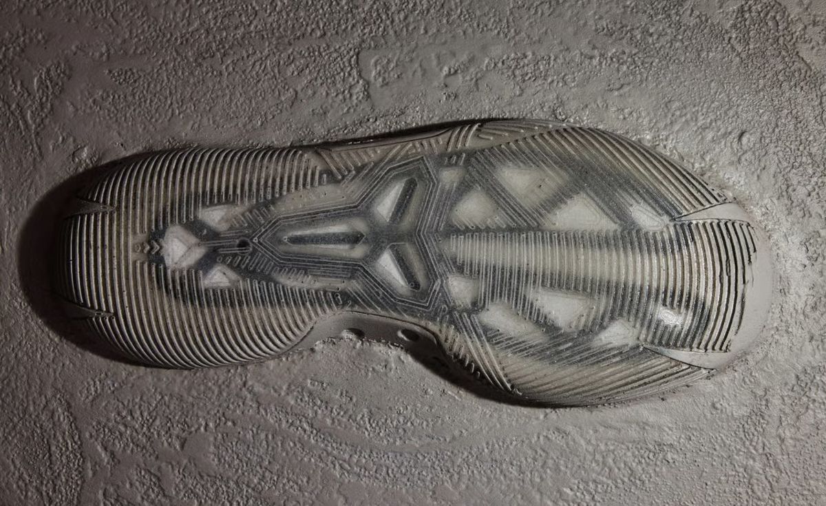 Troy Murray's mural featuring Nike Kobe signature silhouettes from Kobe 1 through Kobe AD, with an unreleased model at the end displaying a semi-transparent outsole design.