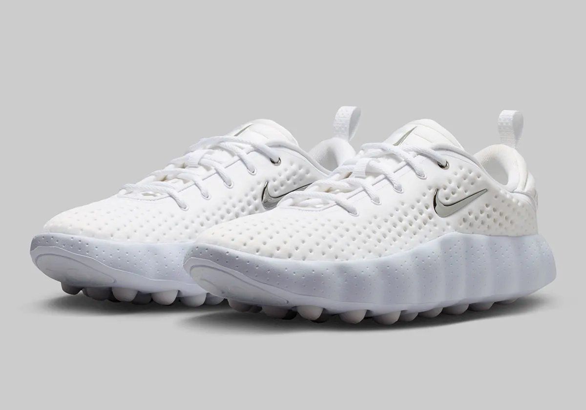 Nike Mind 002 in Vast Grey colorway with white, Anthracite, and Metallic Silver Swoosh