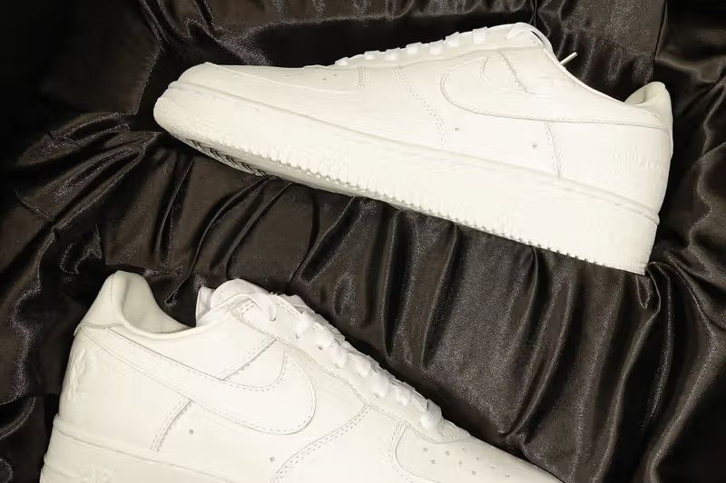 JAY-Z x Nike Air Force 1 Low 'Reasonable Doubt' triple-white sneaker with embossed Roc-A-Fella branding and custom heel graphics