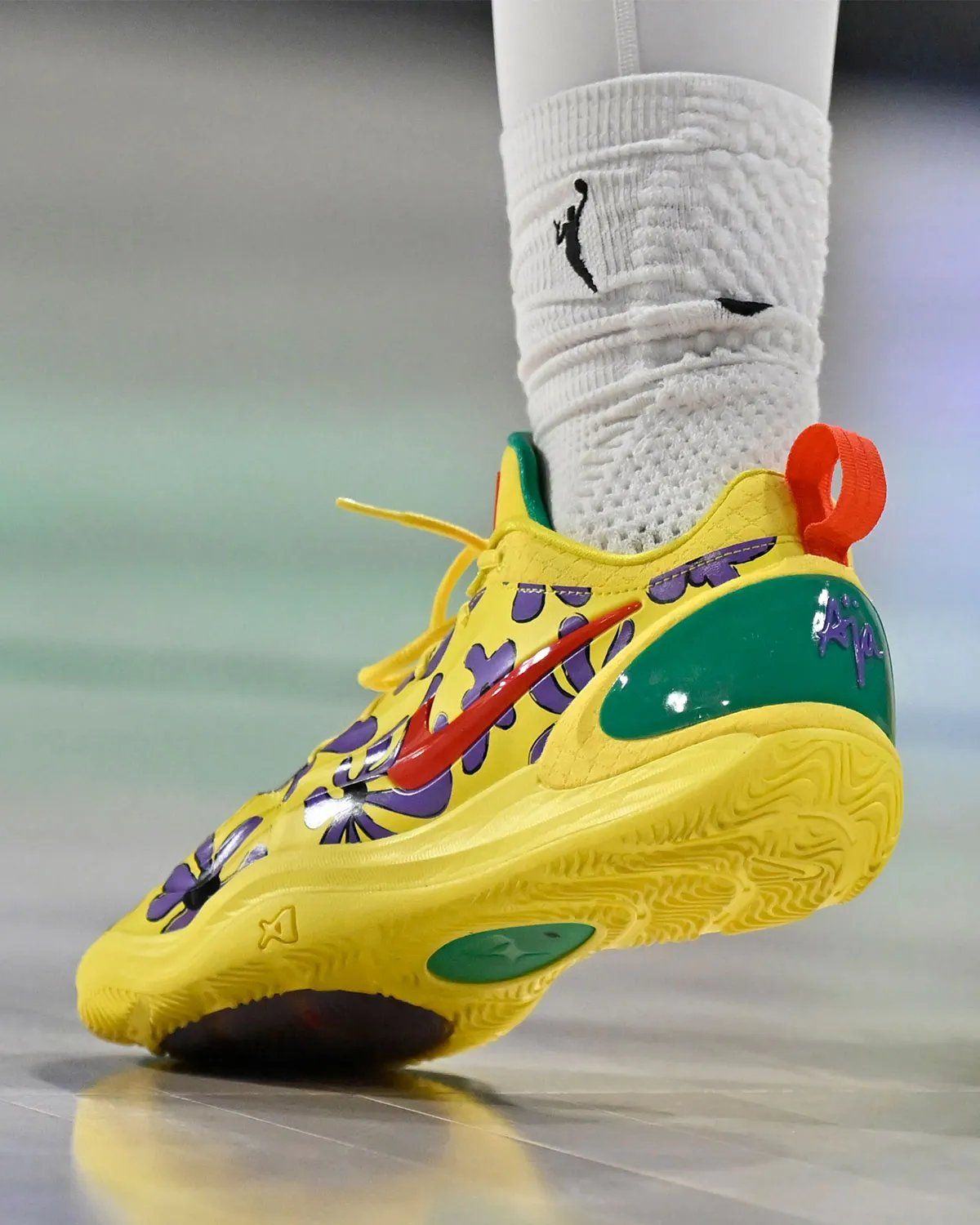 Nike A'Two PE in yellow with purple florals and red trim, inspired by Rugrats' Susie Carmichael, worn by A'ja Wilson