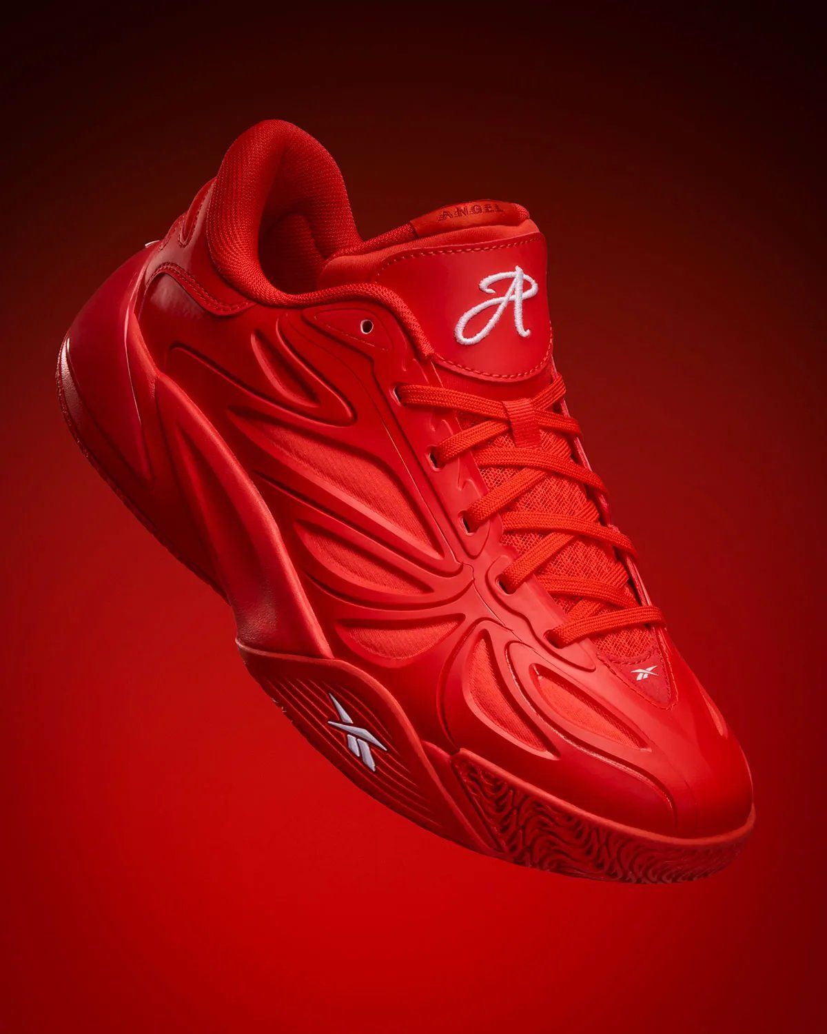 Reebok Angel Reese 1 in Atlanta Dream red with white branding, lateral view